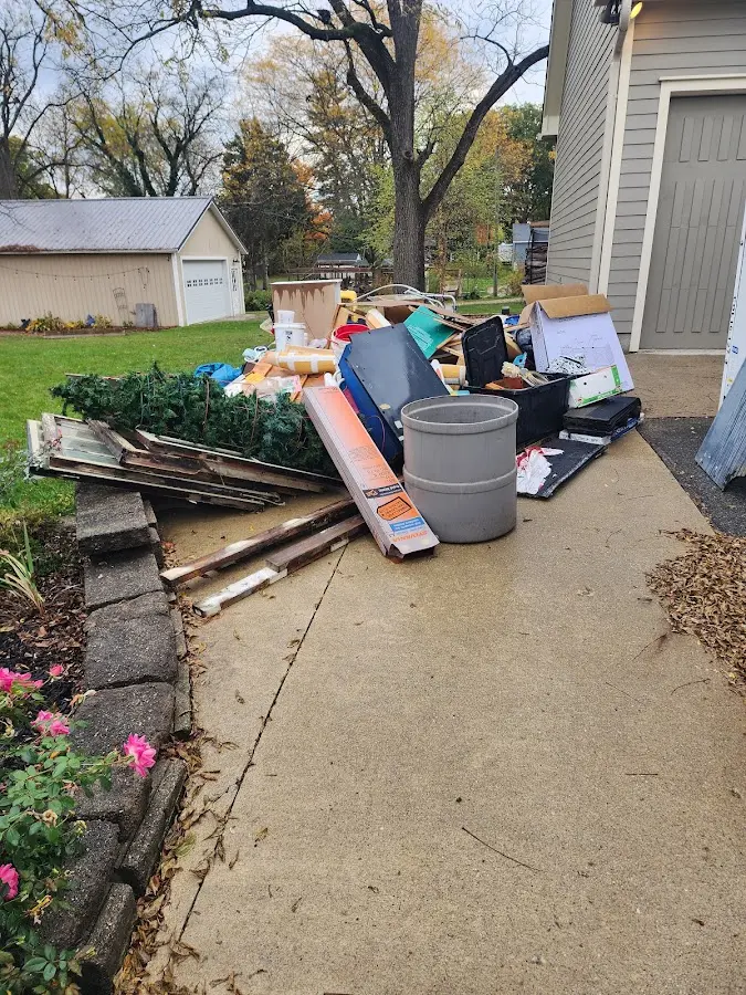 Dumpster being loaded with debris for 10 Yard Dumpster Rental in Temple City